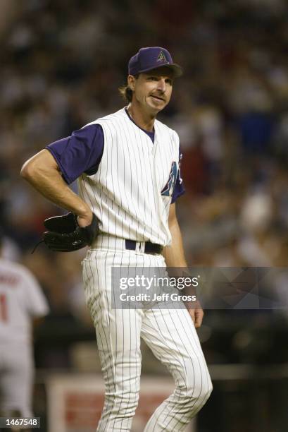 Pitcher Randy Johnson of the Arizona Diamondbacks walks off the field in disgust after giving up a two-run homerun in the first inning against the...