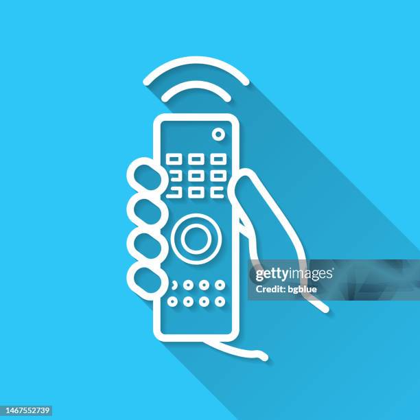 hand with remote control. icon on blue background - flat design with long shadow - holding remote control stock illustrations