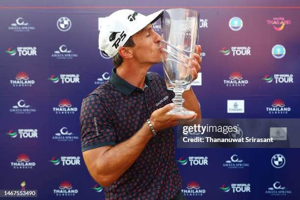 Thorbjorn Olesen of Denmark kisses the Thailand Classic Trophy after winning the Thailand Classic at Amata Spring Country Club on February 19, 2023...