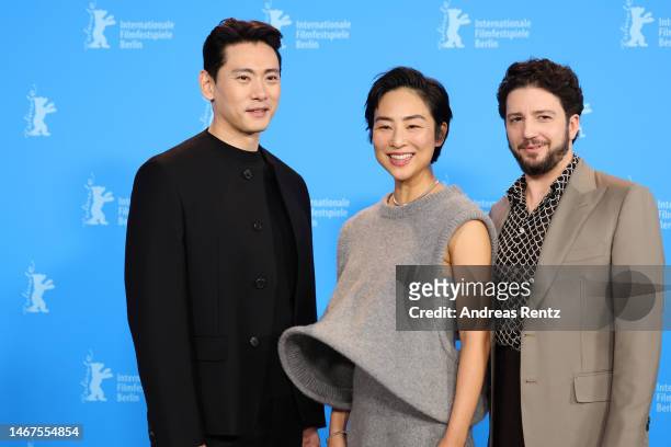Teo Yoo, Greta Lee and John Magaro pose at the "Past Lives" photocall during the 73rd Berlinale International Film Festival Berlin at Grand Hyatt...