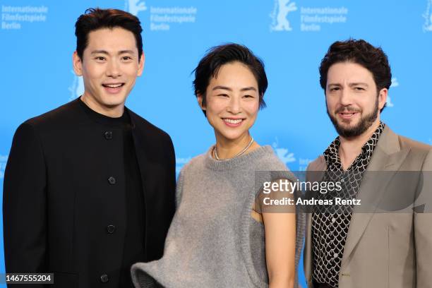 Teo Yoo, Greta Lee and John Magaro pose at the "Past Lives" photocall during the 73rd Berlinale International Film Festival Berlin at Grand Hyatt...