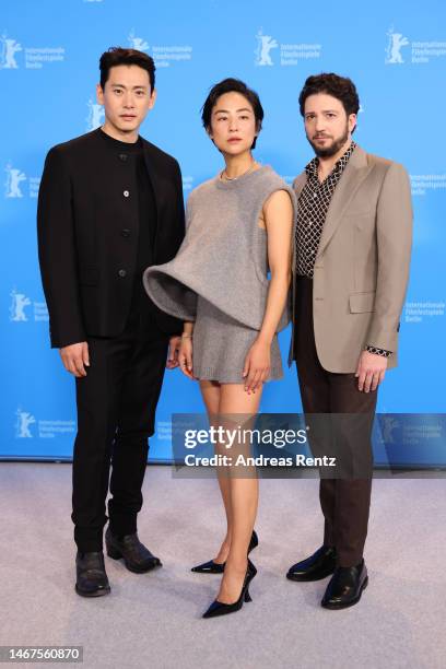 Teo Yoo, Greta Lee and John Magaro pose at the "Past Lives" photocall during the 73rd Berlinale International Film Festival Berlin at Grand Hyatt...