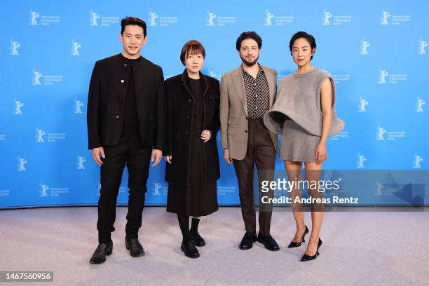 Teo Yoo, Celine Song, John Magaro and Greta Lee pose at the "Past Lives" photocall during the 73rd Berlinale International Film Festival Berlin at...