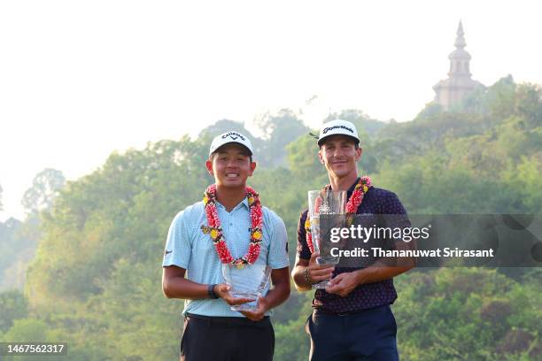 Ratchanon Chantananuwat of Thailand poses with the Amateur Trophy and Thorbjorn Olesen of Denmark poses with the Thailand Classic Trophy after...