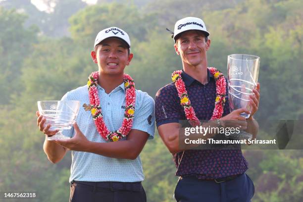 Ratchanon Chantananuwat of Thailand poses with the Amateur Trophy and Thorbjorn Olesen of Denmark poses with the Thailand Classic Trophy after...