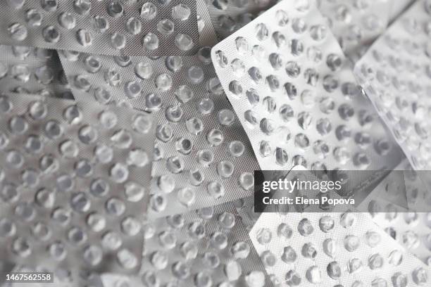 full frame empty silver blister packs of pills - lysine stock pictures, royalty-free photos & images