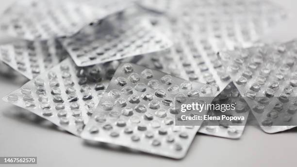 empty silver blister packs of pills background - lysine stock pictures, royalty-free photos & images
