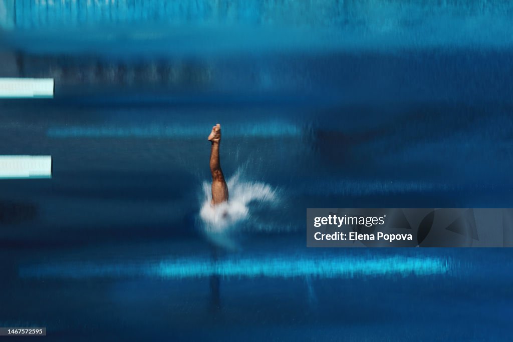 Unknown Amateur Sportsman Diving Into Water Outdoor In Swimming Pool