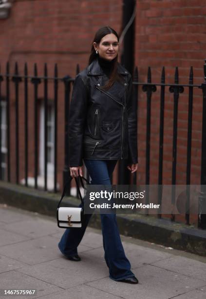 Lydia Zacharis seen wearing a black and white Yves Saint Laurent bag, jeans, a black turtle neck and a dark leather jacket before the 16Arlington...