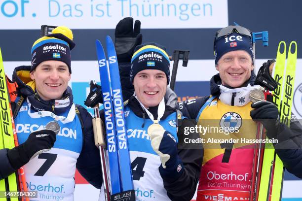 Silver medalist Martin Ponsiluoma of Sweden, gold medalist Sebastian Samuelsson of Sweden and bronze medalist Johannes Thingnes Boe of Norway pose...