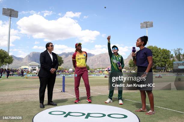 Bismah Maroof of Pakistan flips the coin as Hayley Matthews of West Indies looks on ahead of the ICC Women's T20 World Cup group B match between...