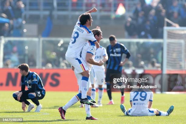 Federico Baschirotto of US Lecce celebrates at the final whistle with teammate Pietro Ceccaroni during the Serie A match between Atalanta BC and US...