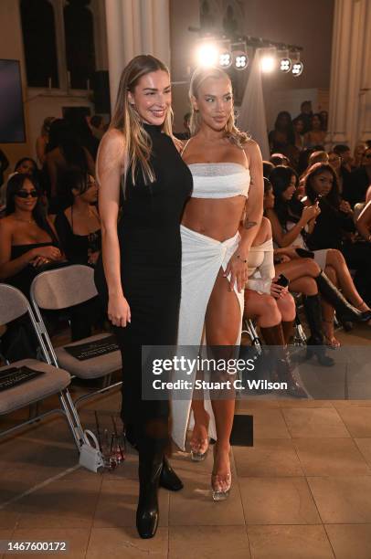 Zara McDermott and Tammy Hembrow attend Oh Polly's Runway Show at London Fashion Week 2023 at St. John's Hyde Park on February 18, 2023 in London,...