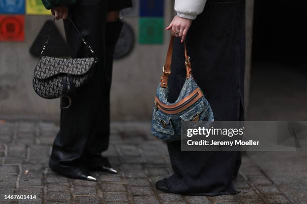 Fashion week guest seen wearing a green quilted jacket, black pants, black shades and a Dior saddle bag and another fashion week guest seen wearing a...