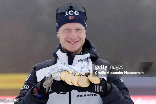 Johannes Thingnes Boe of Norway poses for a photo with all their medals during the medal ceremony for the Men 15 km Mass Start at the IBU World...