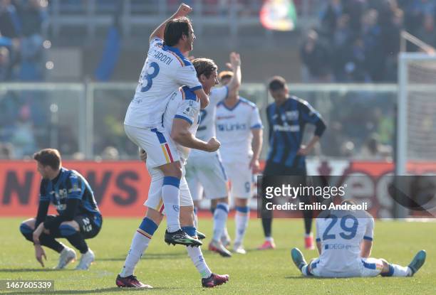 Federico Baschirotto of US Lecce celebrates at the final whistle with teammate Pietro Ceccaroni during the Serie A match between Atalanta BC and US...