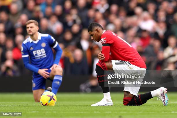 Marcus Rashford of Manchester United takes a knee prior to the Premier League match between Manchester United and Leicester City at Old Trafford on...