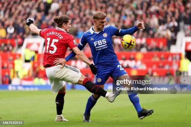 Marcel Sabitzer of Manchester United contends for the aerial ball with Kiernan Dewsbury-Hall of Leicester City during the Premier League match...