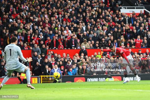 Marcus Rashford of Manchester United scores the team's first goal as Danny Ward of Leicester City attempts to make a save during the Premier League...