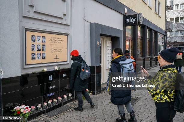 People stand at a crime scene of the 2020 mass shooting on February 19, 2023 in Hanau, Germany. On February 19, 2020 Tobias Rathjen shot dead nine...