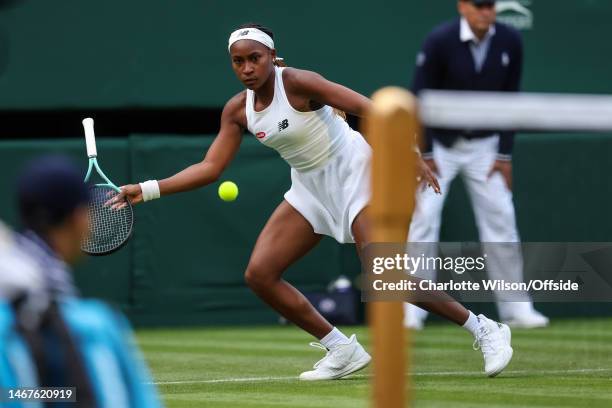 Coco Gauff uses her racquet upside down after dropping it during her Women' Singles match with Sofia Kenin during day one of The Championships...