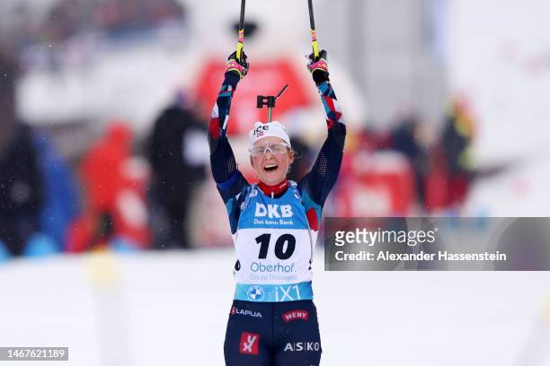 Silver medalist Ingrid Landmark Tandrevold of Norway celebrates as she approaches the finish line during the Women 12.5 km Mass Start at the IBU...