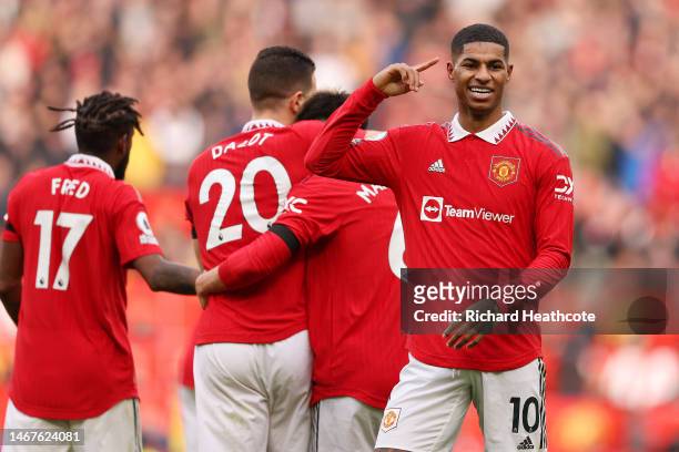 Marcus Rashford of Manchester United celebrates after scoring the team's second goal with teammates during the Premier League match between...