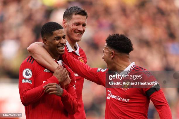 Marcus Rashford of Manchester United celebrates after scoring the team's second goal with teammates Wout Weghorst and Jadon Sancho during the Premier...