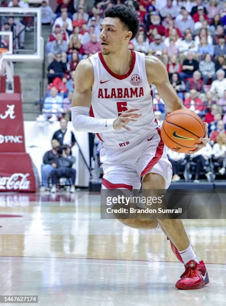 Jahvon Quinerly of the Alabama Crimson Tide drives to the basket during the second half against the Georgia Bulldogs at Coleman Coliseum on February...