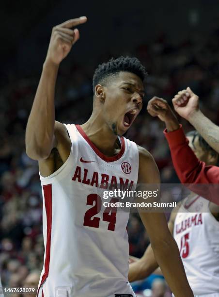 Brandon Miller of the Alabama Crimson Tide celebrates a second half three pointer by a team mate against the Georgia Bulldogs at Coleman Coliseum on...