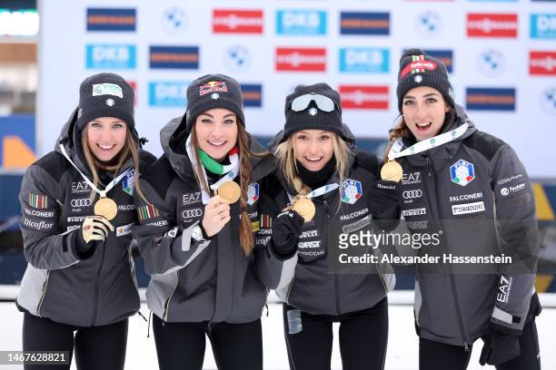 Gold medalists Samuela Comola of Italy, Dorothea Wierer of Italy, Hannah Auchentaller of Italy and Lisa Vittozzi of Italy pose for a photo during the...