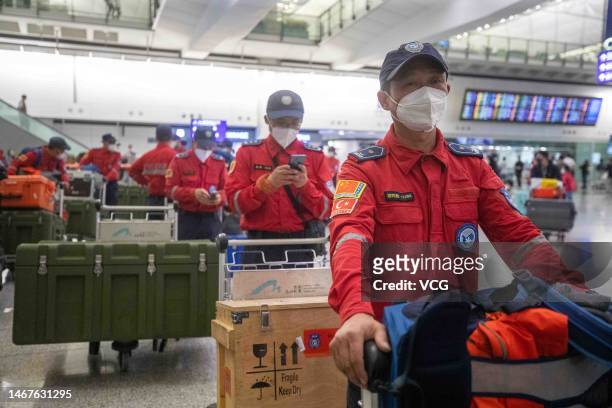 Members of Shenzhen Rescue Volunteers Federation arrive at Hong Kong International Airport after completing rescue and search mission in quake-hit...