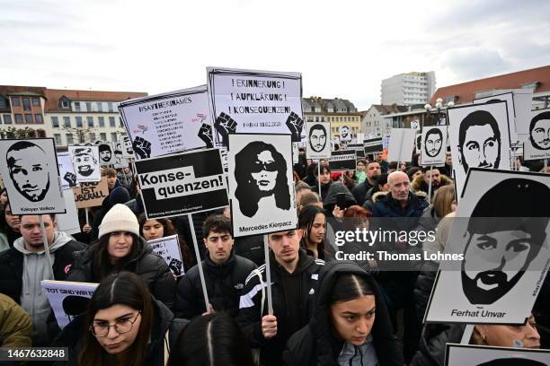 People hold of the 2020 mass shooting while the commemorates on February 19, 2023 in Hanau, Germany. On February 19, 2020 Tobias Rathjen shot dead...