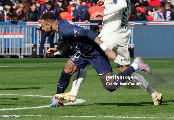 Neymar Jr of PSG is injured after being tackled by Benjamin Andre of Lille during the Ligue 1 match between Paris Saint-Germain and Lille OSC at Parc...