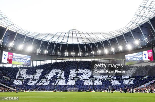 General view of the inside of the stadium as fans of Tottenham Hotspur form a TIFO to form the name "Harry", as fans celebrate after Harry Kane...