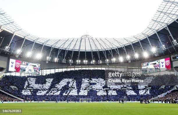 General view of the inside of the stadium as fans of Tottenham Hotspur form a TIFO to form the name "Harry", as fans celebrate after Harry Kane...