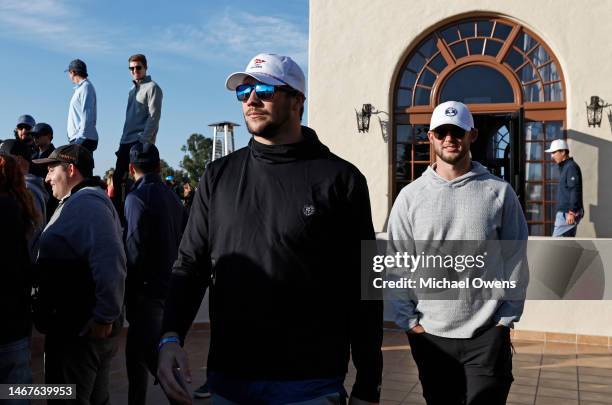 Buffalo Bills quarterback Josh Allen watches Tiger Woods of the United States on the first tee during the final round of the Genesis Invitational at...