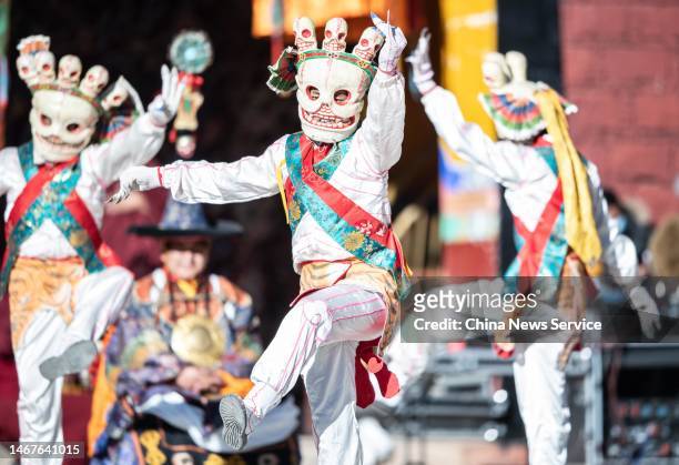 Tibetan Buddhist monks wearing masks perform cham dance at Chubu Temple in Doilungdeqen District on February 19, 2023 in Lhasa, Tibet Autonomous...