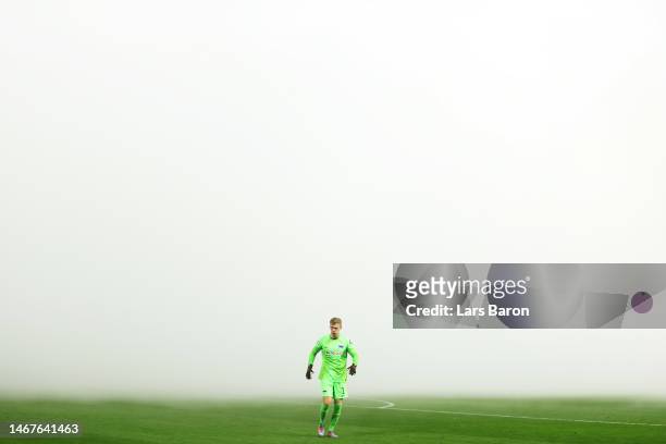 General view of the smoke on the inside of the stadium as fans of Borussia Dortmund burn flares as Oliver Christensen of Hertha Berlin looks on prior...