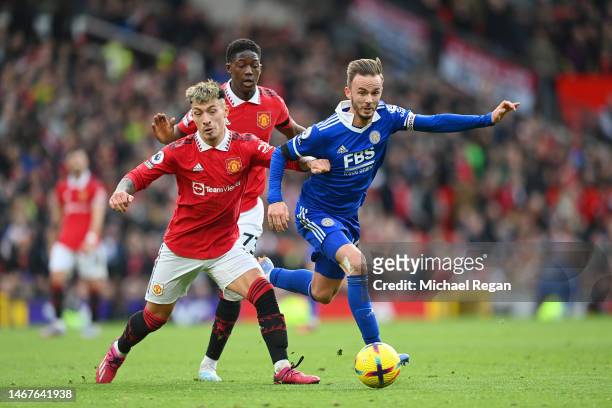 James Maddison of Leicester City is challenged by Lisandro Martinez and Kobbie Mainoo of Manchester United during the Premier League match between...
