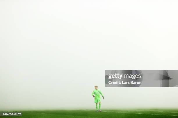 General view of the smoke on the inside of the stadium as fans of Borussia Dortmund burn flares as Oliver Christensen of Hertha Berlin looks on prior...