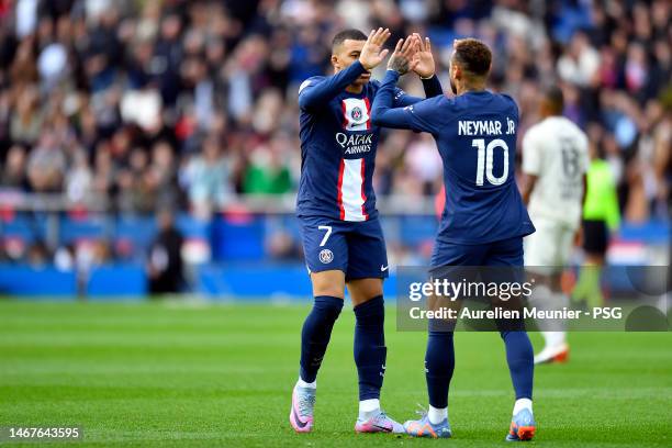 Neymar Jr of Paris Saint-Germain is congratulated by teammate Kylian Mbappe after scoring during the Ligue 1 match between Paris Saint-Germain and...