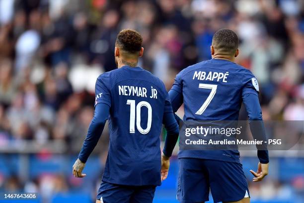 Neymar Jr of Paris Saint-Germain is congratulated by teammate Kylian Mbappe after scoring during the Ligue 1 match between Paris Saint-Germain and...