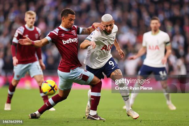 Richarlison of Tottenham Hotspur is challenged by Thilo Kehrer of West Ham United during the Premier League match between Tottenham Hotspur and West...