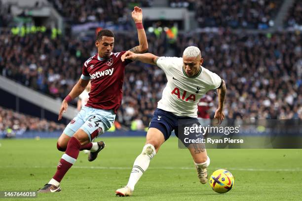 Richarlison of Tottenham Hotspur is challenged by Thilo Kehrer of West Ham United during the Premier League match between Tottenham Hotspur and West...