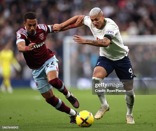 Richarlison of Tottenham Hotspur is challenged by Thilo Kehrer of West Ham United during the Premier League match between Tottenham Hotspur and West...