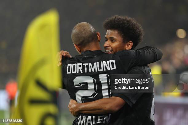 Karim Adeyemi of Borussia Dortmund celebrates after scoring the team's first goal with teammate Donyell Malen during the Bundesliga match between...