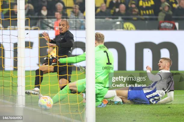 Donyell Malen of Borussia Dortmund scores the team's second goal as Oliver Christensen of Hertha Berlin fails to make a save during the Bundesliga...