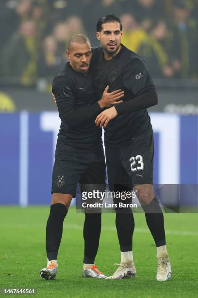 Donyell Malen of Borussia Dortmund celebrates after scoring the team's second goal with teammate Emre Can during the Bundesliga match between...