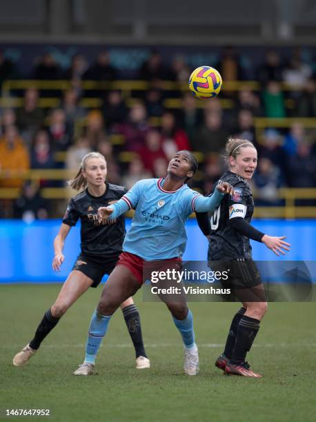 Khadija Shaw of Manchester City in action with Leah Williamson and Kim Little of Arsenal during the FA Women's Super League match between Manchester...